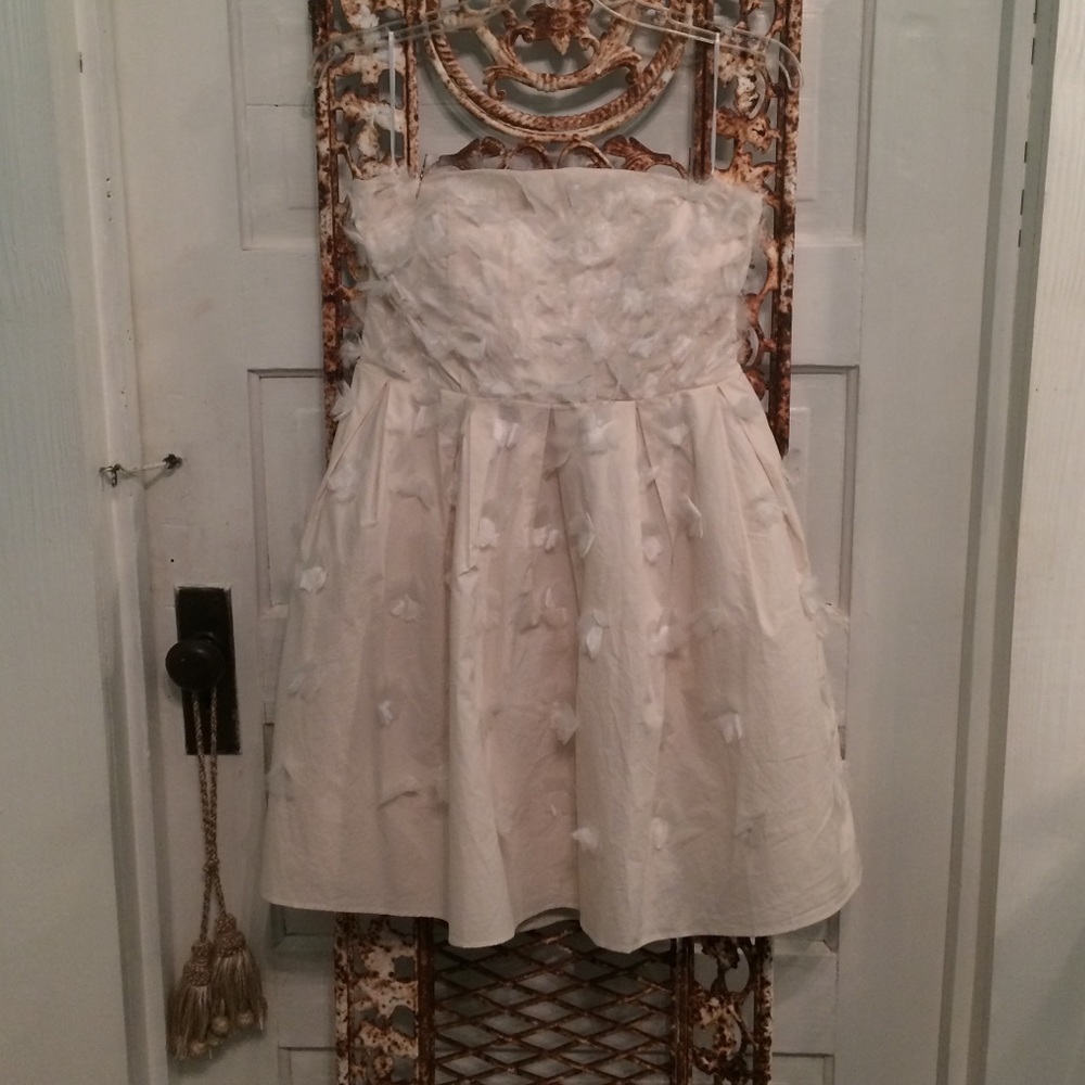 Minuet strapless off-white dress.